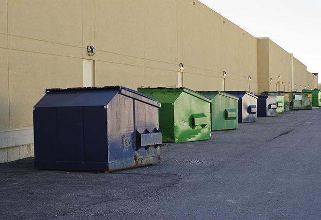 a large dumpster awaits materials from a renovation project in Bourne, MA